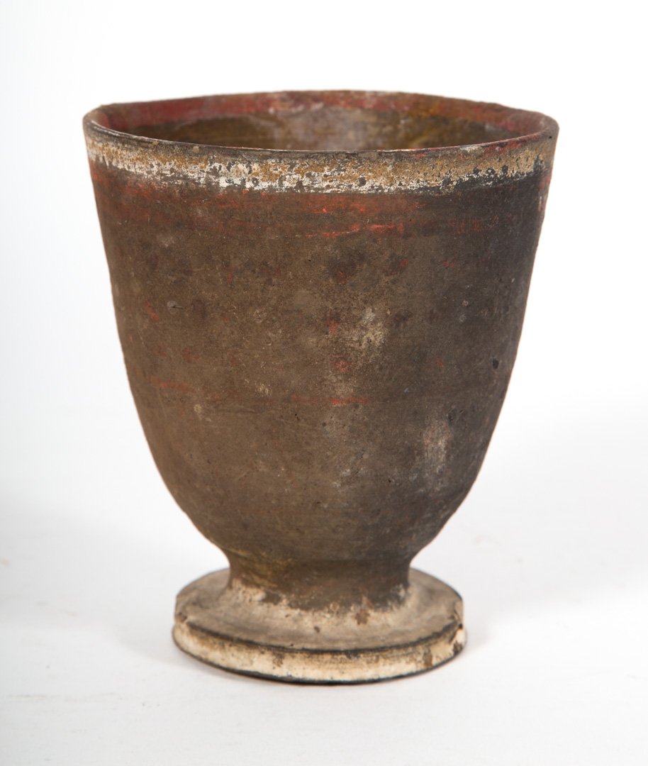 Ancient painted earthenware goblet: possibly Italian: crisply turned buff earthenware with linear red and black painted decoration; 4 1/8 in. H.