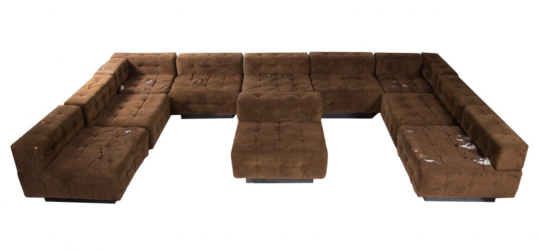 Mid-century modern upholstered sectional sofa: circa 1960; Harvey Probber, eight straight and two corner upholstered sections on ebonized bases, each section 25 in. H., 33 in. W., 33 in. D.