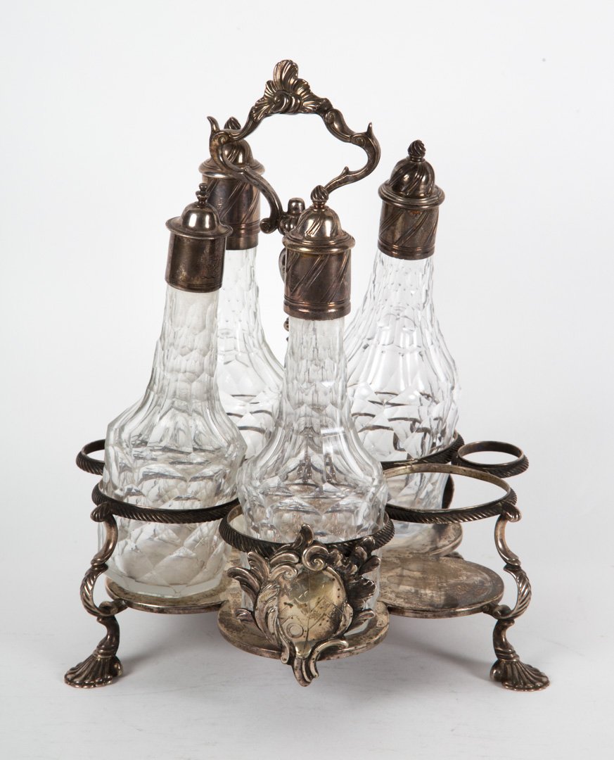 Georgian sterling silver cruet stand: Samuel Wood, London, 1758-59, with 4 silver mounted cut glass cruets, 38.85 ozt.