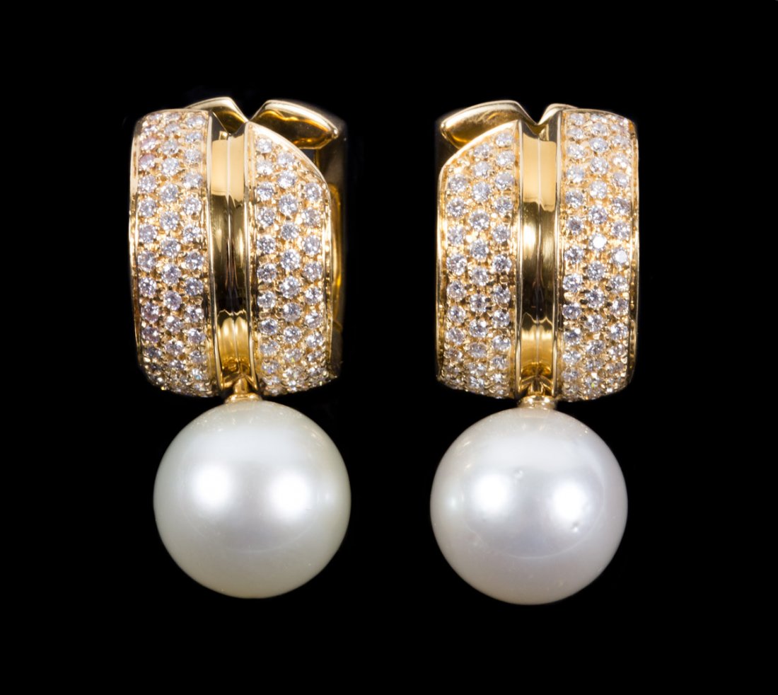 A Pair of Diamond & Pearl Earrings by Antonini: Italian diamond and pearl earrings mounted in 18K gold