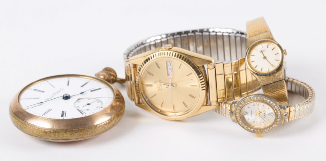 Three Wristwatches and a Pocket Watch: including: a Gentlemenâ€™s Seiko, Illinois pocket watch, Ladyâ€™s Seiko and a Gloria Vanderbilt