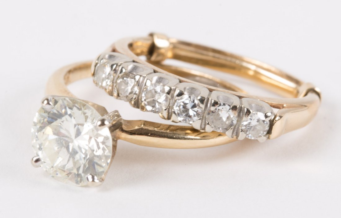 A Diamond Wedding Set: featuring a round brilliant solitaire diamond, weighing approximately 2 carats, mounted in 14K gold, and a diamond band with six circular diamonds, mounted in 14K gold