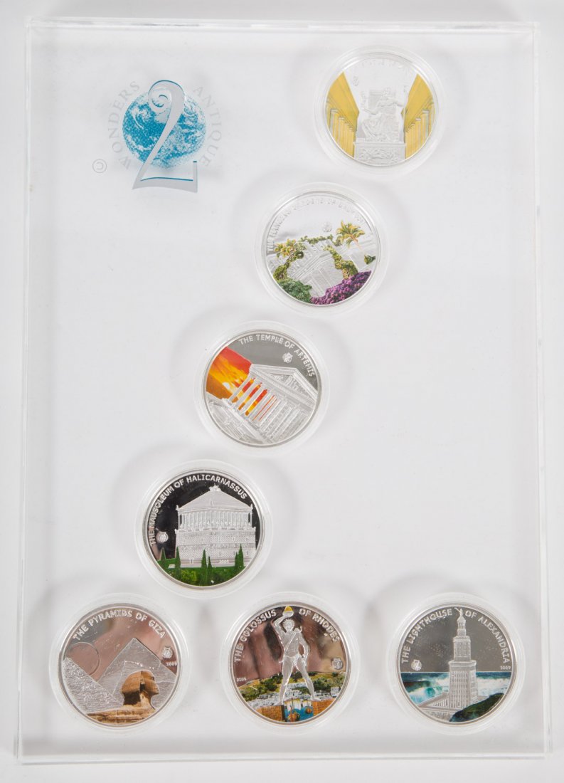 [Foreign] Palau Coin Set: A 2009 â€œSeven Wonders of the Worldâ€ deluxe 7-coin set from Palau, in a Lucite holder and original box. Features seven partially-colorized, silver-plated $1 coins, prooflike grade.