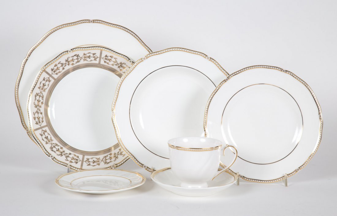 Wedgwood bone china partial dinner service: in the "Crown Gold" pattern, 72 pieces, including: 12 dinner plates, 12 soup bowls, 12 luncheon plates, 12 bread plates, 12 teacups, 12 saucers, and 12 similar "Crown Gold" luncheon plates