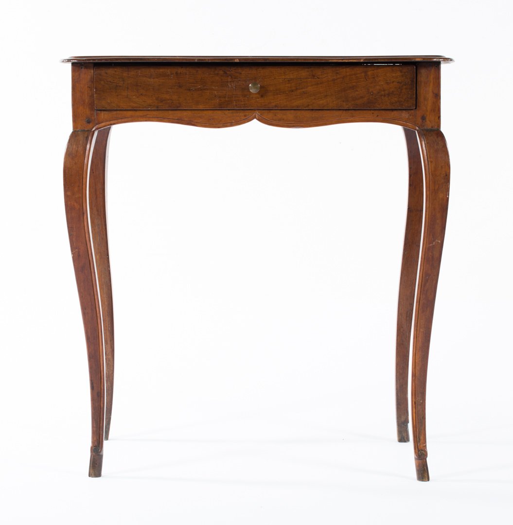 Louis XV Provincial style fruitwood stand: 19th century; flat mahogany top with molded edge, long drawer in case, cabriole legs, hoof feet, 27 in. H., 25 in. W., 17 in. D.