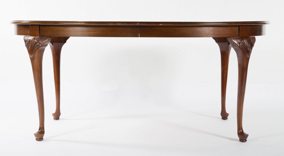 Queen Anne style mahogany dining table: 20th century; two 34 in. half-round banded inlaid ends with two 20" leaves, 29 1/2 in H., 44 1/2 in. W.