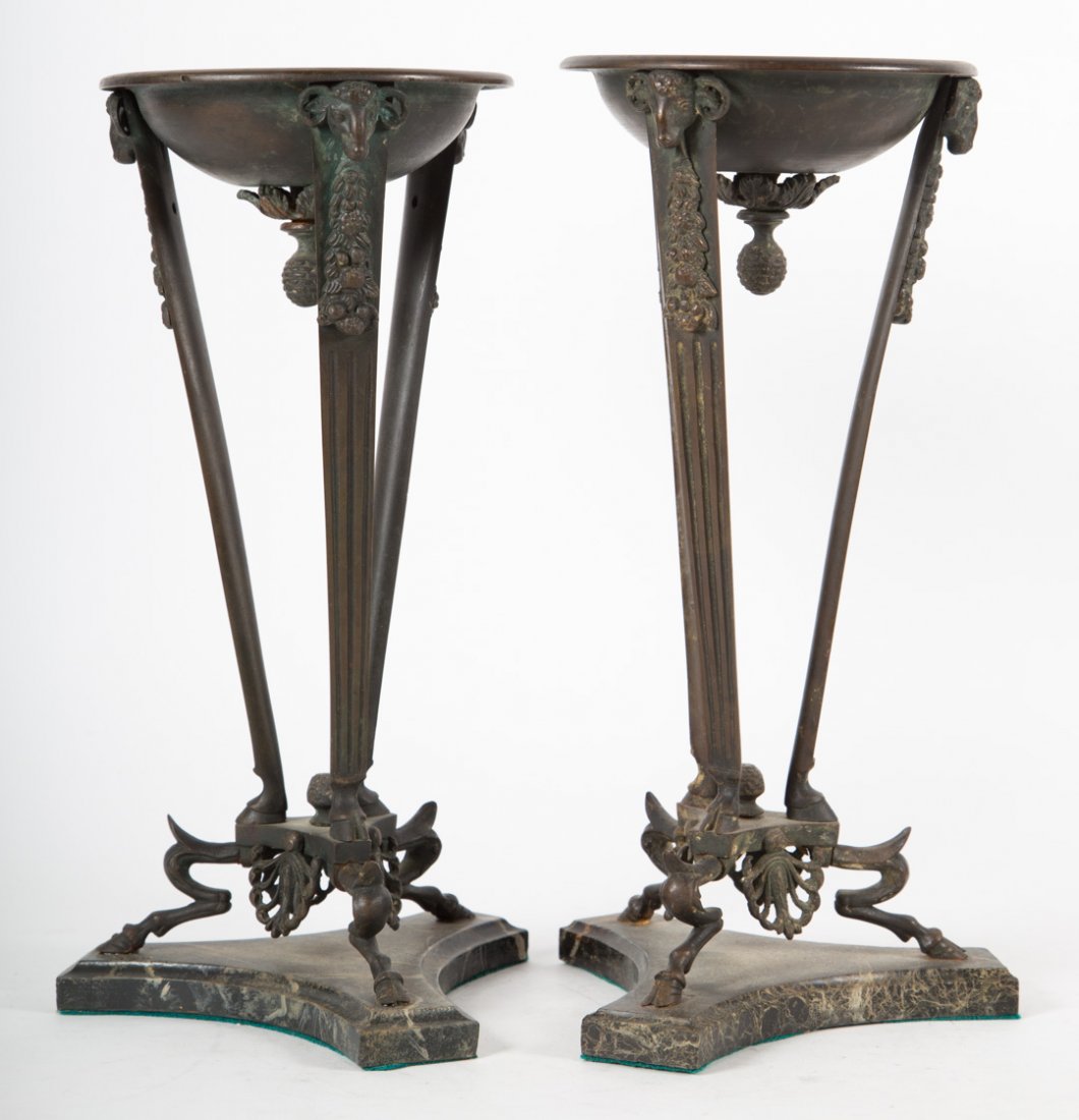 Pair of Grande Tour copper alloy torcheres: second half-19th century; mounted on triform marble bases, 12 in. H.