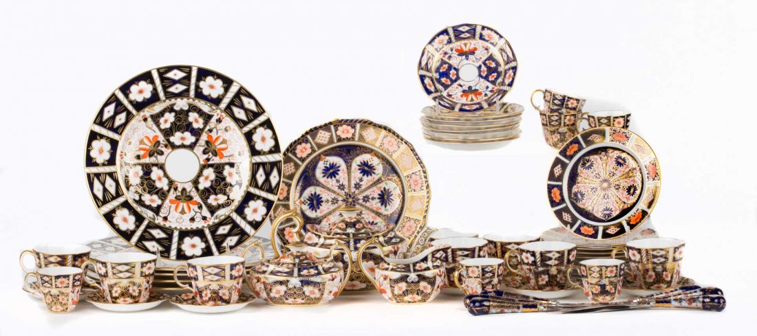 Royal Crown Derby Old Imari partial dinner service: assembled set, comprising 47 pieces, including: 5 dinner plates, 1 luncheon plate, 10 bread plates, 8 teacups, 8 saucers, 6 demitasse cups, 6 saucers, teapot, creamer, sugar, also includes 6 knives wi
