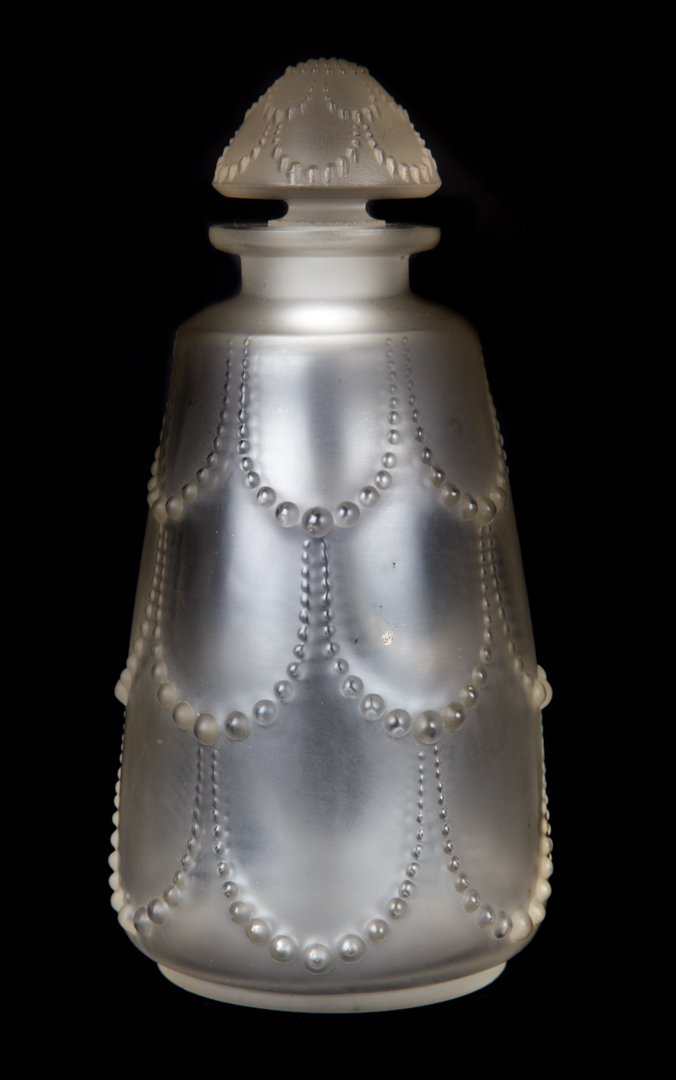 Lalique crystal Perles scent bottle: circa 1930s; with pearl relief swags, molded mark "R. Lalique," 7 in. H.