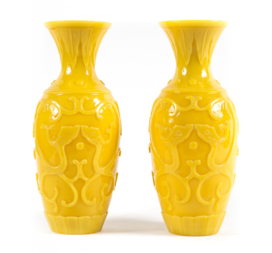 Pair of Peking carved yellow glass baluster vases: early 20th century; with raised dragon relief decoration, 10 in. H. Collection of Helen Canzoneri