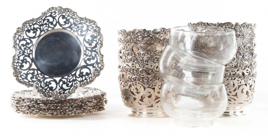 Twelve sterling dessert bowl frames & underplates: American reticulated sterling silver dessert bowl frames and matching underplates, three glass bowls included, 126.95 ozt. of silver