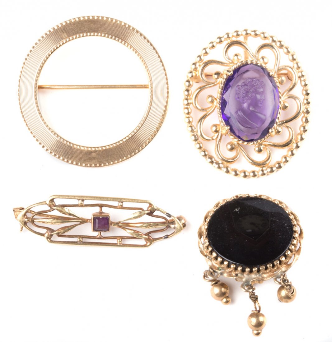 A Selection of Pins Featuring a Carved Amethyst (1 of 7)