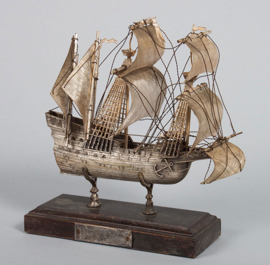 Pewter model of a Spanish galleon period 1540: with a wood and metal base, 5 1/2 in. L.