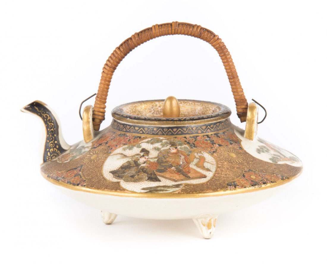 Japanese Satsuma earthenware wine pot: circa 1900; with floral decoration and vignettes with warriors, signed underneath, 5 in. Diam.