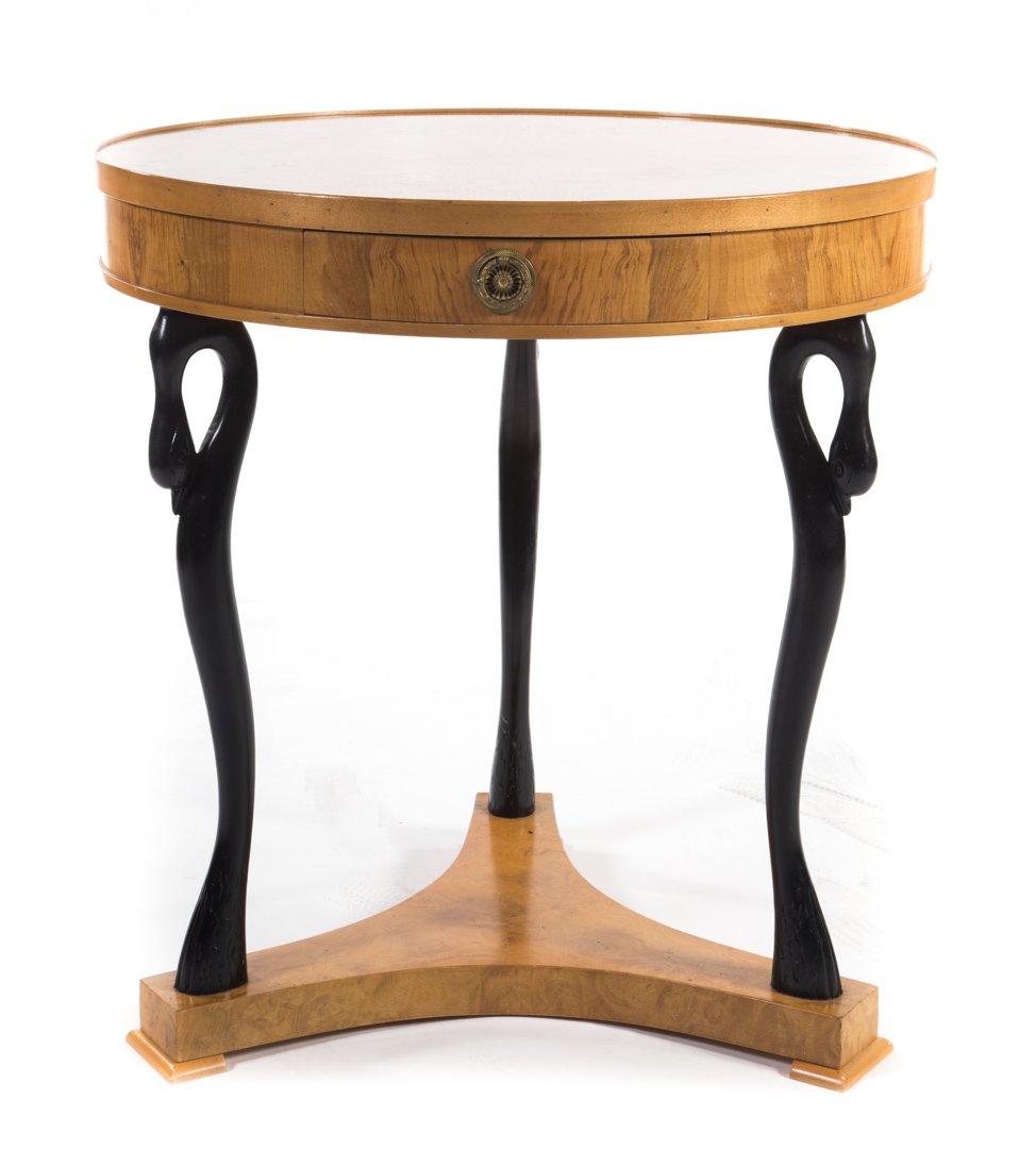 French Empire style burlwood gueridon: inlaid segmented 23 in. round top, three ebonized swan-form legs on triform base, 24 1/2 in. H.