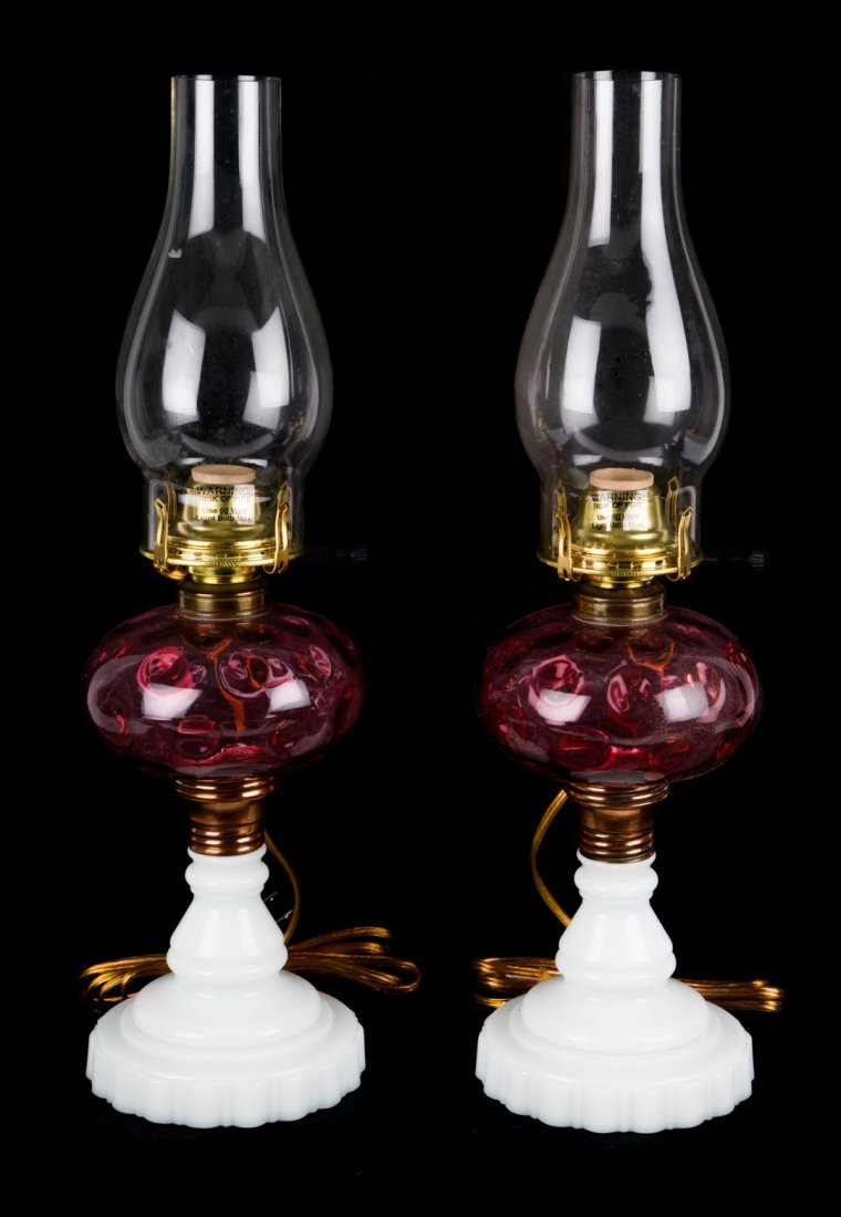 Pair of American glass and copper fluid lamps: mid-19th century; thumb print pattern, cranberry oil font with copper cuff on clam broth glass base, with removable electrical font and chimney, lamp - 9 1/2 in. H.