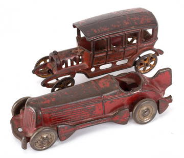 Cast iron race car and touring sedan: first quarter-20th century; Champion Hardware Co. red cast iron racer, 8 in. L., and a red cast iron touring sedan, probably Kenton, 6 3/4 in. L.