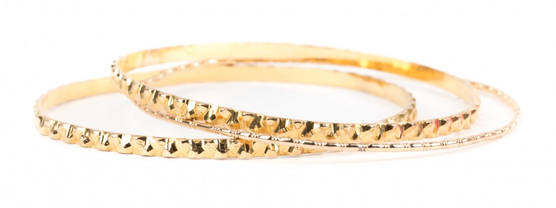 A Trio of Gold Bangle Bracelets (1 of 3)