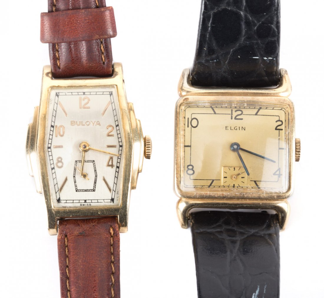 A Pair of Gentleman's Watches: 1) Elgin watch, rectangular face, subdial second hand, black strap and 2) Bulova watch, gold plated tank style, subdial second hand, brown strap, 49 grams tw