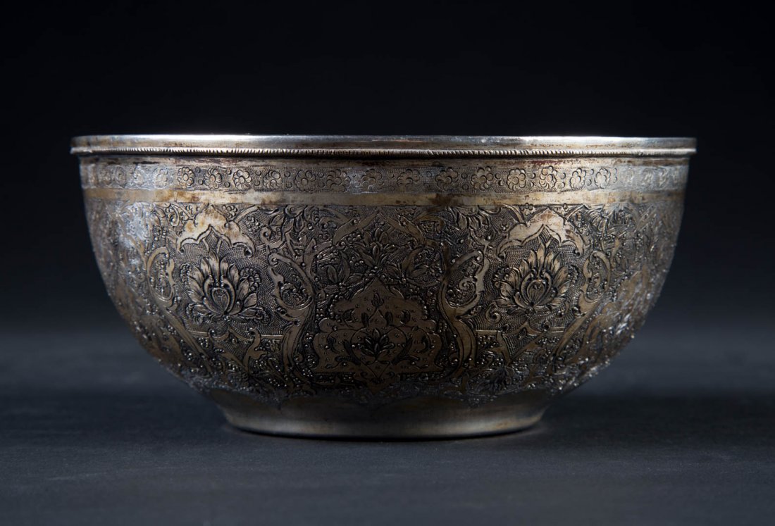 Iranian handcrafted silver bowl: 20th century, 6 in. Diam., 4.80 ozt.; Ghalam Zani is the art of engraving and embossing elaborate designs, patterns and shapes on metals such as copper, silver, gold and brass. This art has a long his