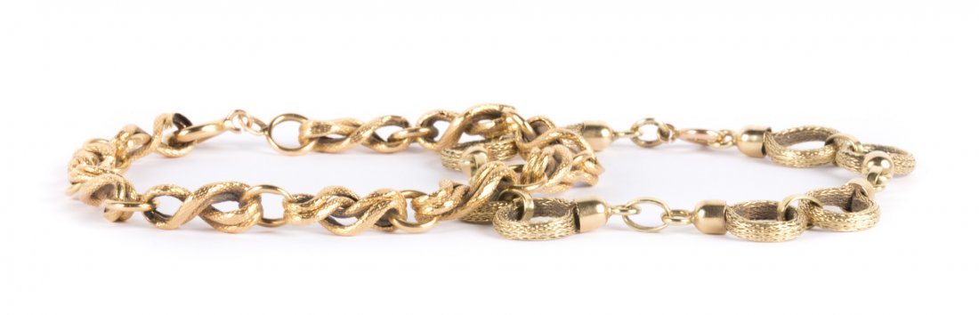 A Pair of Lady's Gold Link Bracelets: 1) 14K yellow gold textured twist link bracelet with heavy spring ring clasp, 8.5 in. L and 2) 14K yellow gold textured open circle link bracelet with heavy spring ring clasp, 7.5 in. L, 23 grams tw