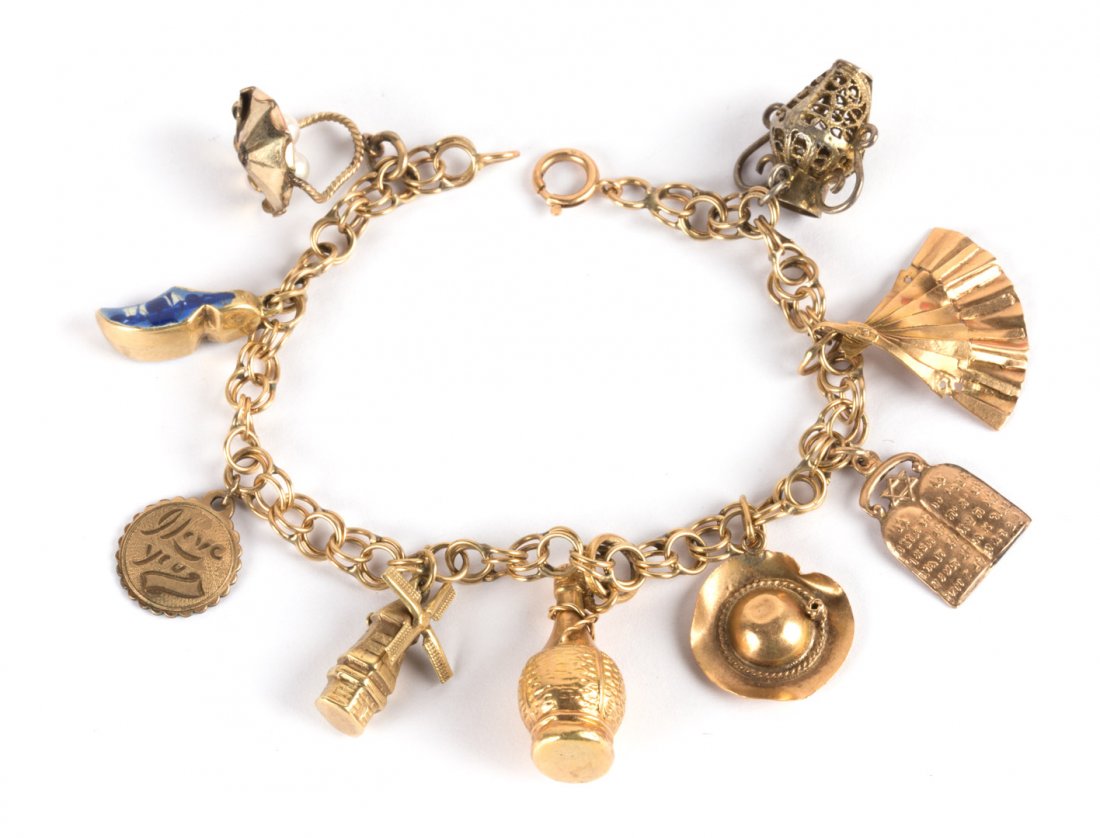 A Lady's Gold Charm Bracelet with 9 Charms (1 of 4)