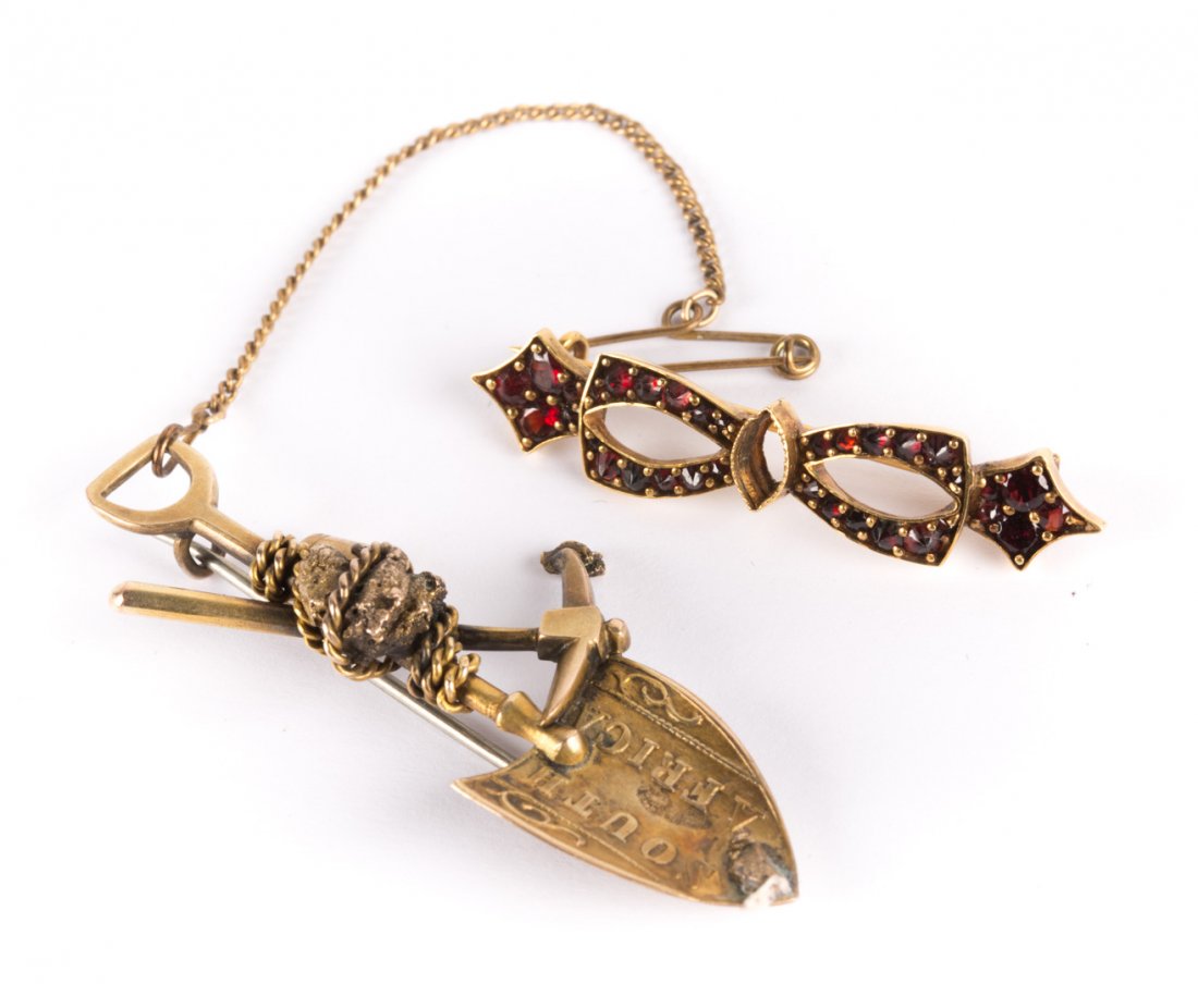 A Gold Shovel Pin & A Gold Garnet Bow Pin (1 of 4)