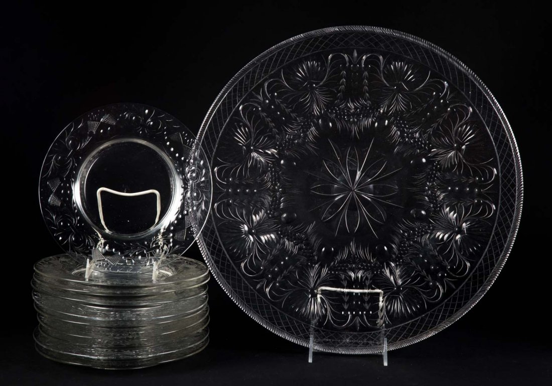 American etched glass plate/serving plate: early 20th century; possibly Pairpoint, 10 plates with cornucopia decoration, 8 1/2 in. Diam., serving plate with floral decoration, 16 1/2 in. Diam.