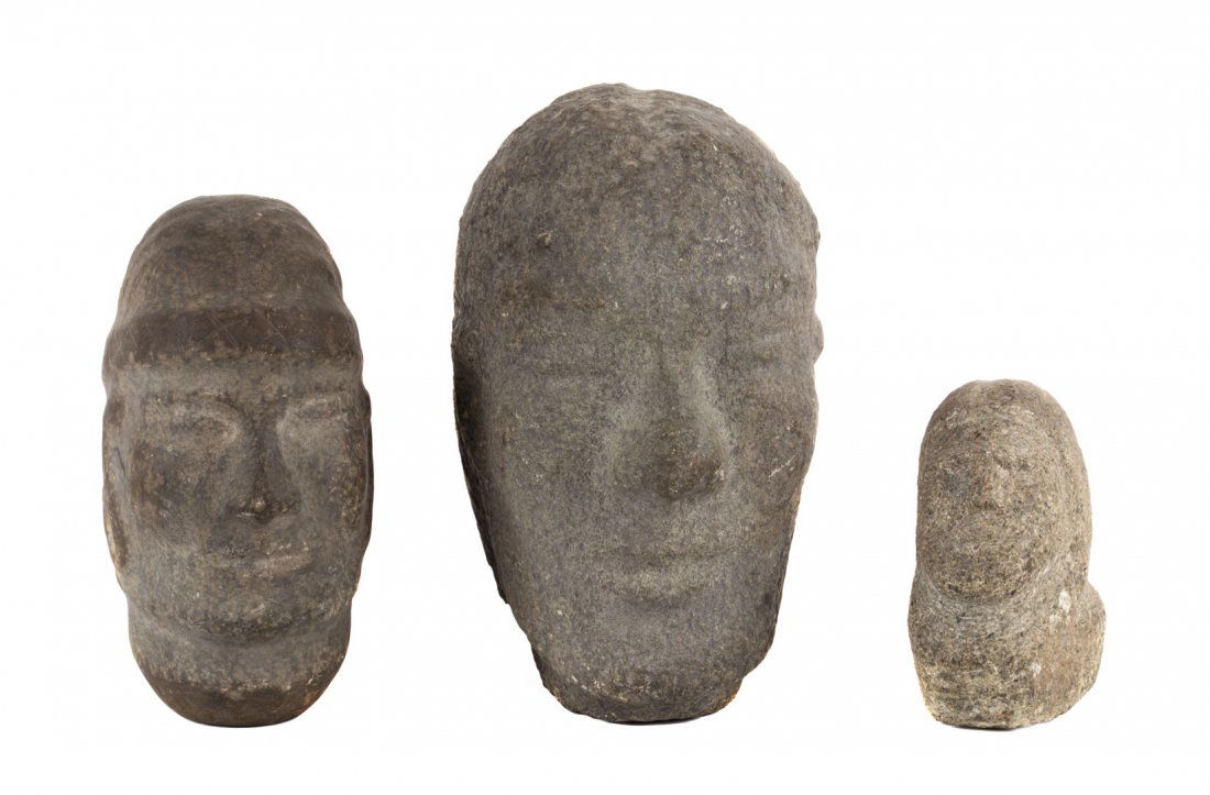 Three archaic carved stone heads (1 of 3)