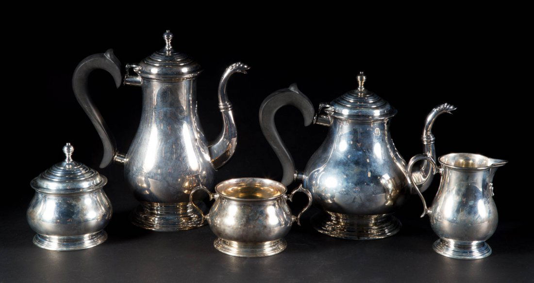 John Coney 1685 repro sterling coffee & tea set: John Coney circa 1685 reproduction sterling silver 5-pc. coffee & tea set, including: coffee pot (9 1/2 in. H.), teapot, covered sugar bowl, cream pitcher and waste bowl, ebonized wood handles, 76.15