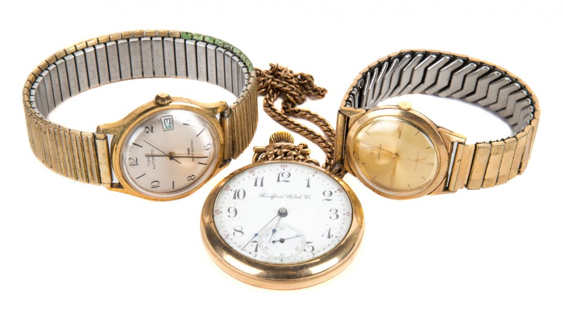 A Trio of Gent's Watches: 1) Gent's Rockford Watch Co. pocket watch with engraving on the back of watch, 15 in. watch chain, 2) Gent's GP Wittnauer, gold face, dashes for numbers, flexible band and 3) Timex, round dial silver