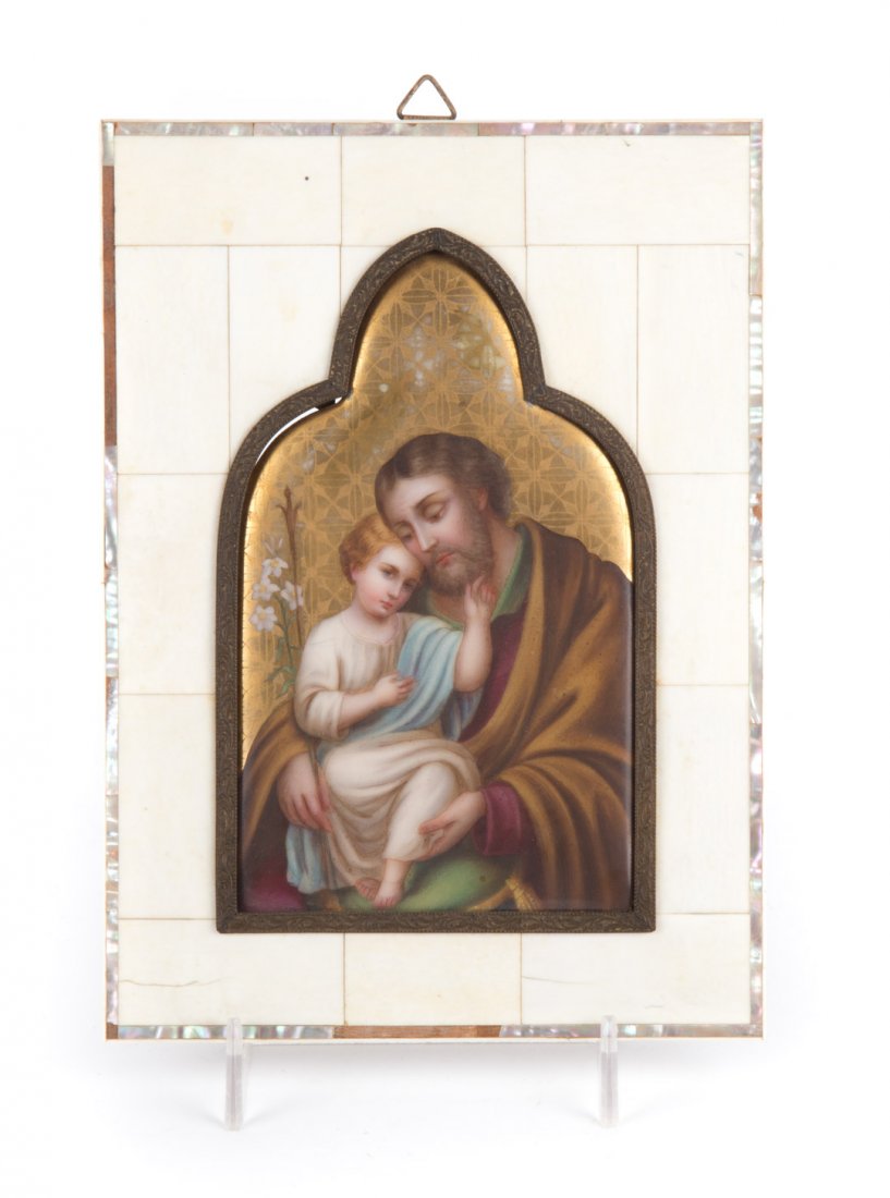 Continental religious porcelain plaque: early 20th century; in the Gothic arch shape, gilt background with painted image of Christ Child with Saint Joseph in sectional bone and mother-of-pearl frame, frame - 8 in. H. 5 3/4 in. W.