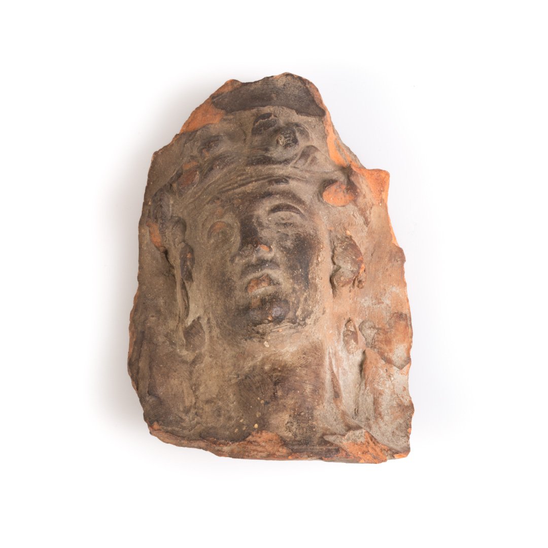 Ancient terracotta head fragment of woman (1 of 3)