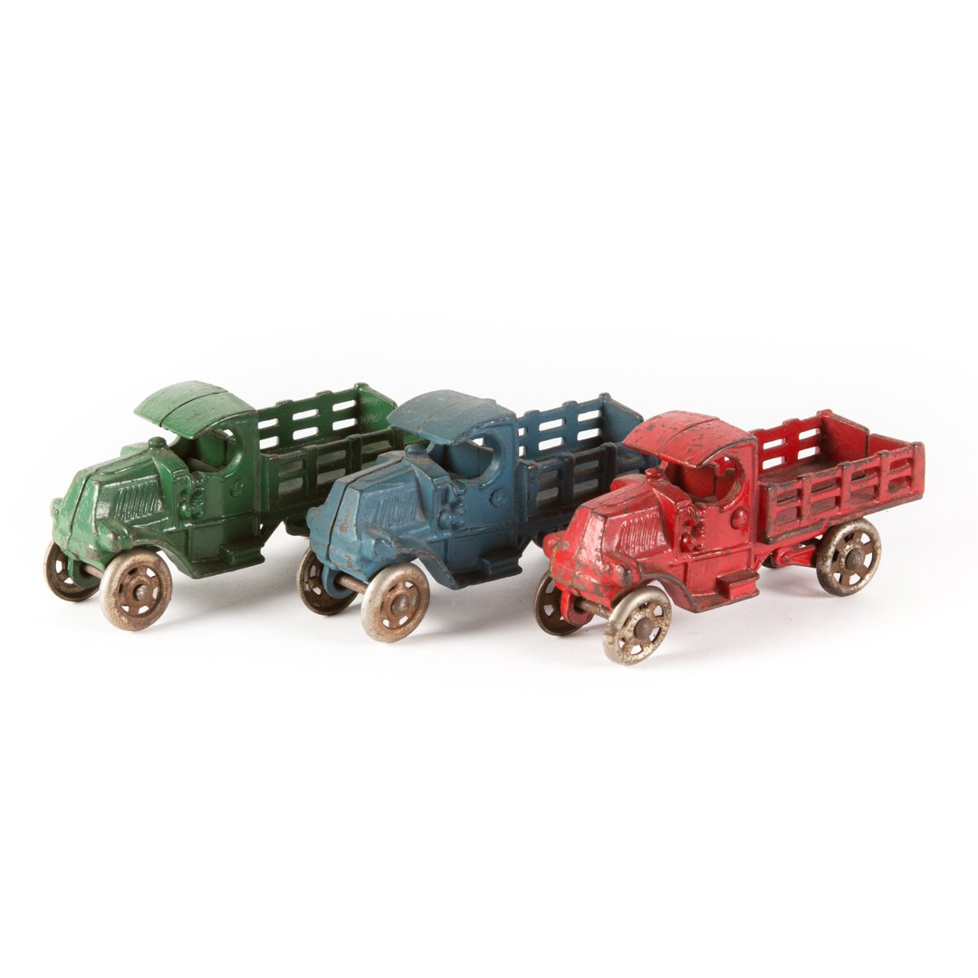 Three arcade or Hubley stake trucks (1 of 2)