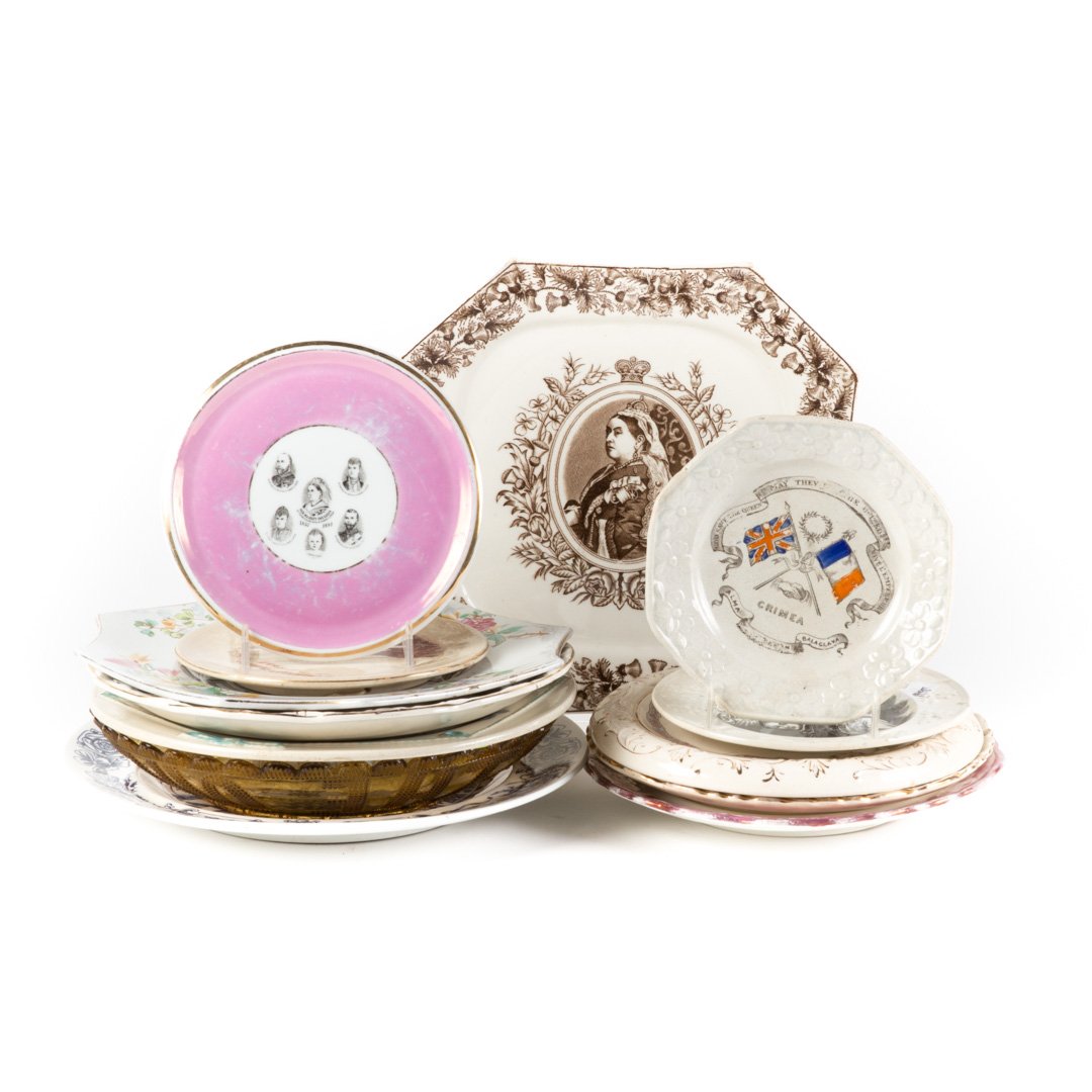 13 Queen Victoria commemorative articles: 19th and 20th centuries; including twelve, transferware plates, bowls and trivets, 6 to 10 1/2 in. Diam. and an amber glass jubilee bowl, 9 1/ 2 in. Diam.