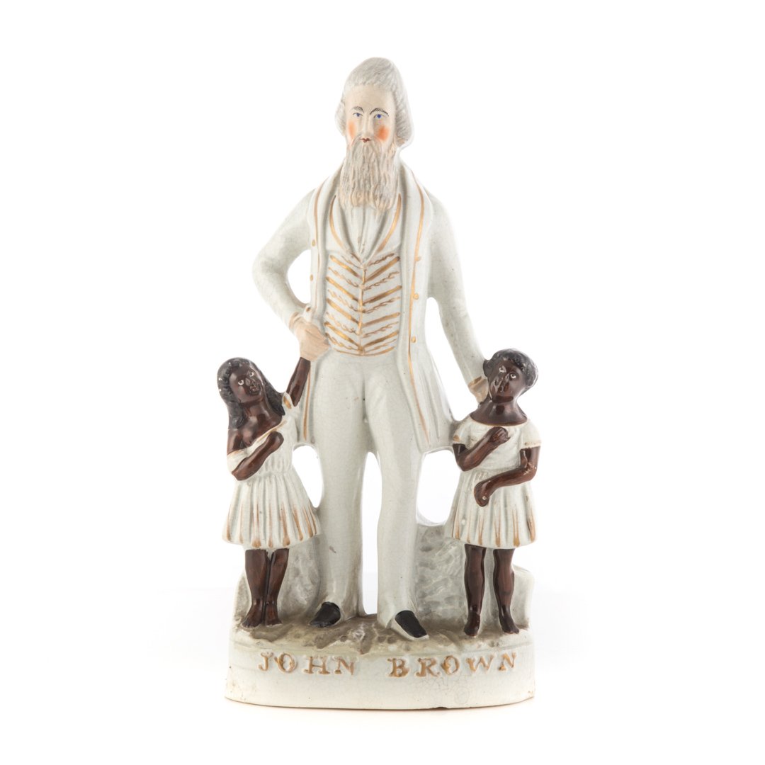 Staffordshire Figure: John Brown, c.1860: Rare Staffordshire painted and gilt pottery figure of the radical abolitionist John Brown, hanged in 1859 for insurrection at Harper's Ferry; 10 7/8 in. H.