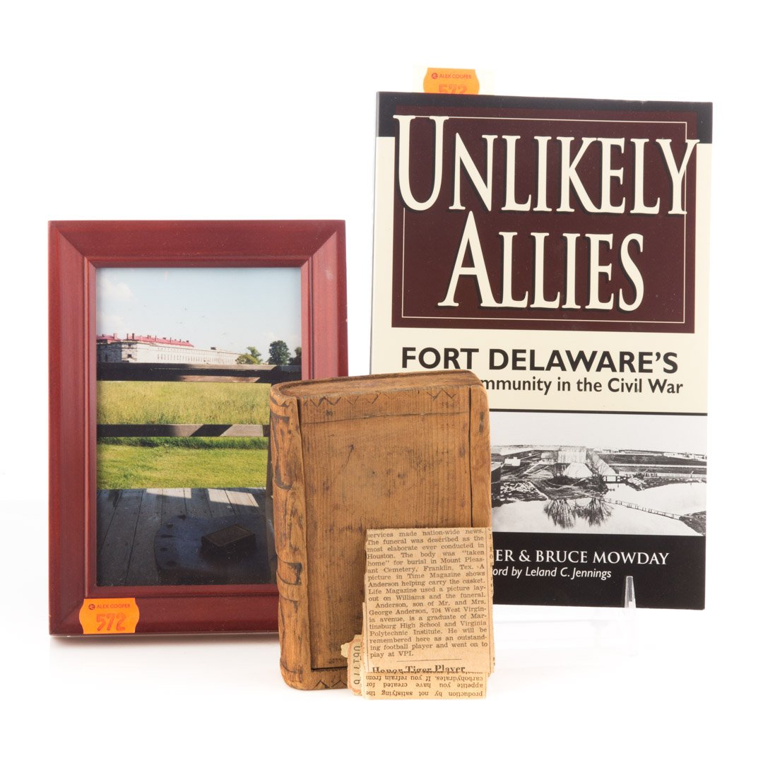 [Civil War] Fort Delaware Confederate POW Relic: An American folk art box with sliding cover, modeled as a book, containing various inscriptions (some very faint) including, "Made by my Dad at Fort Delaware / Rose;" pine, 5 1/8 X 3 1/2 X 1 1/8 in.; 