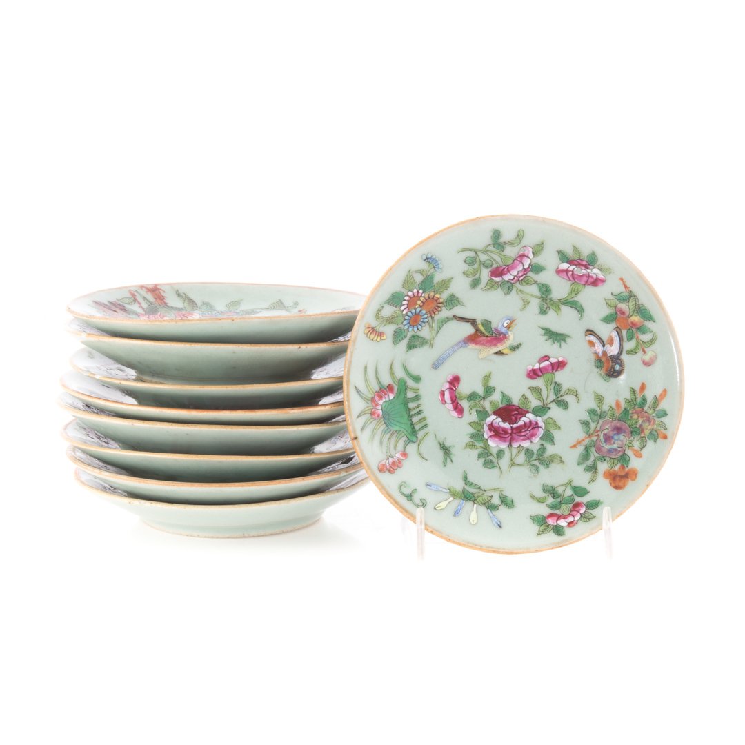 Nine Chinese Export celadon bread plates/saucers: mid 19th-century; with Famille Rose floral, bird, and insect decoration, and blue character marks on verso, 6 in. Diam.