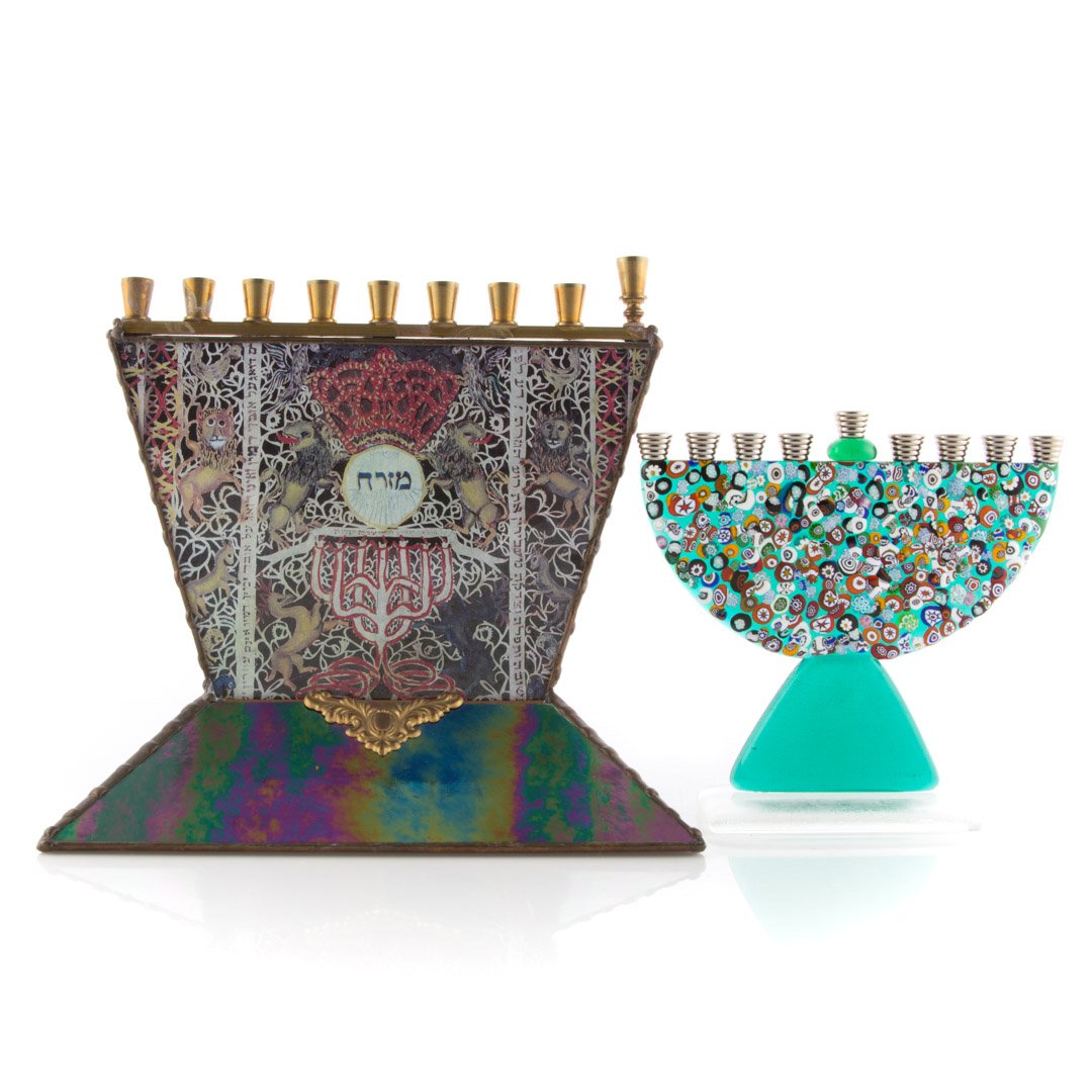 Leona Fein menorah & millefiori menorah: glass and brass menorah, made in the Potichomania method, signed " Leona Fein," 8 1/2 in. H., and a Venetian millefiori glass menorah, 6 in. H.