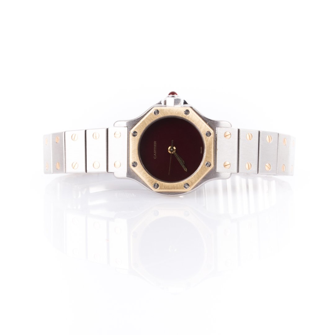 Lady's Cartier Santos Octagonal 18K & Stainless: Cartier Santos Octagonal 18K yellow gold and stainless steel with burgundy face, red spinel for crown, automatique movement, 090745665, deployment buckle with Cartier clasp, 51 grams