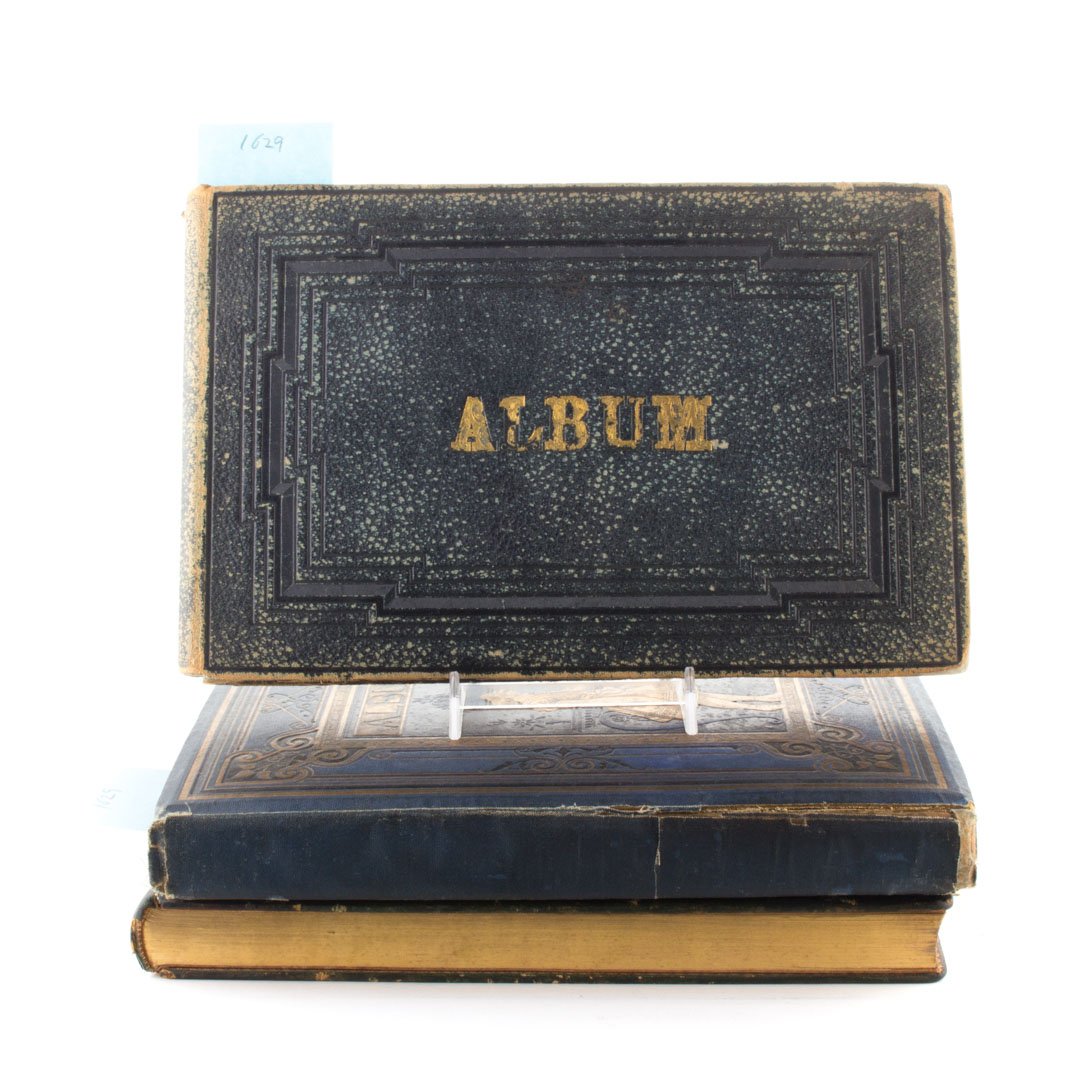 [Albums] Four items: including an album of trade cards and other chromolithographs, many with Pennsylvania associations, with first owner's signature dated 1882; an album of pressed flowers and related inscriptions, put t