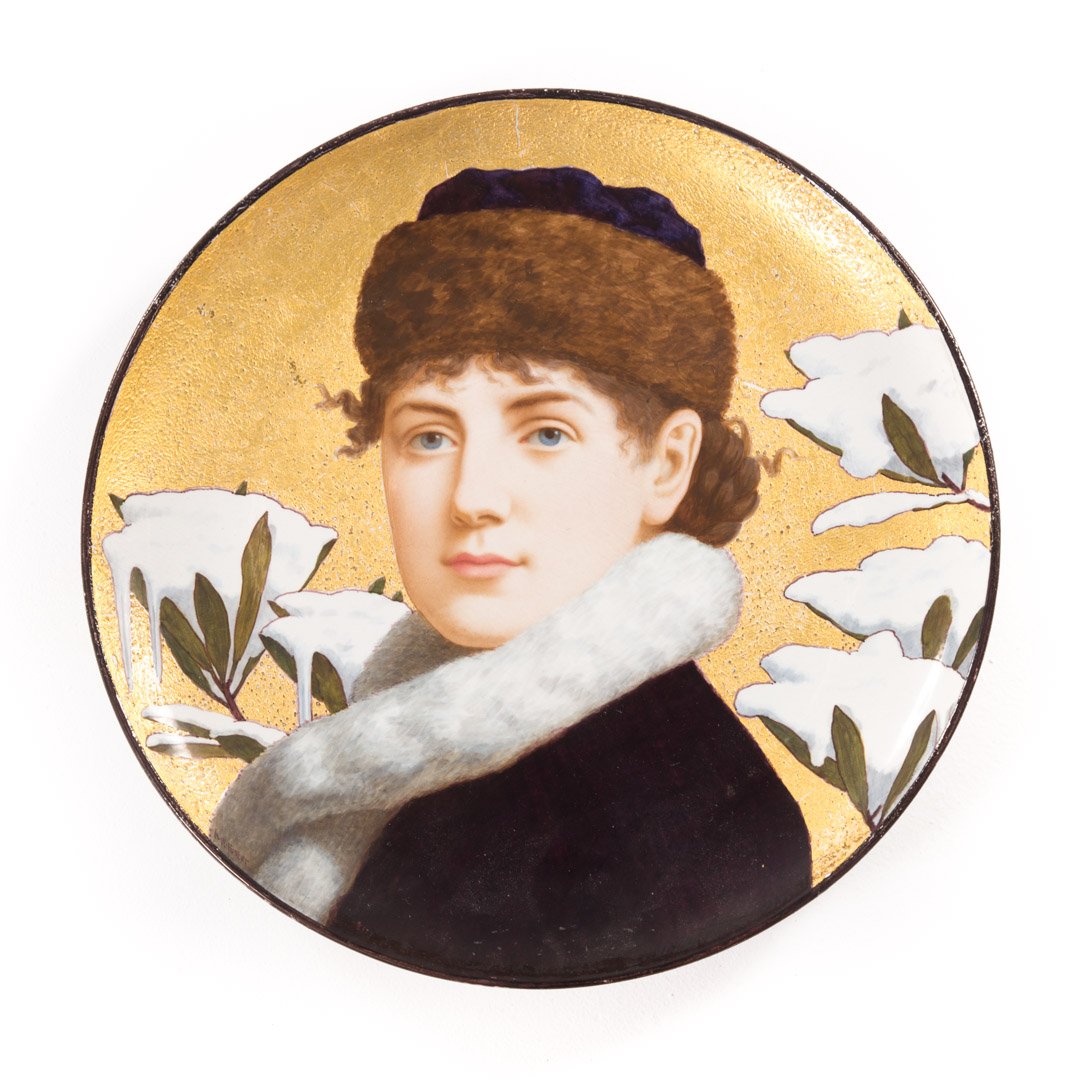 Minton china portrait charger: late 19th century'; detailed portrait of woman in winter apparel on gilt background, with snow- covered leaves, 17 in. Diam.