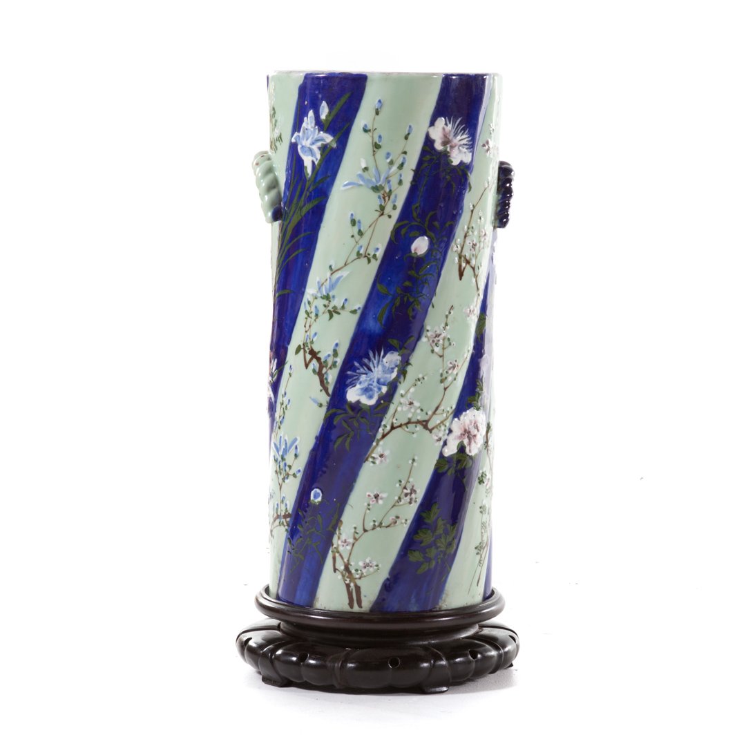 Japanese porcelain garden seat: late 19th century; green celadon and blue stripe decoration. 23 in. H.