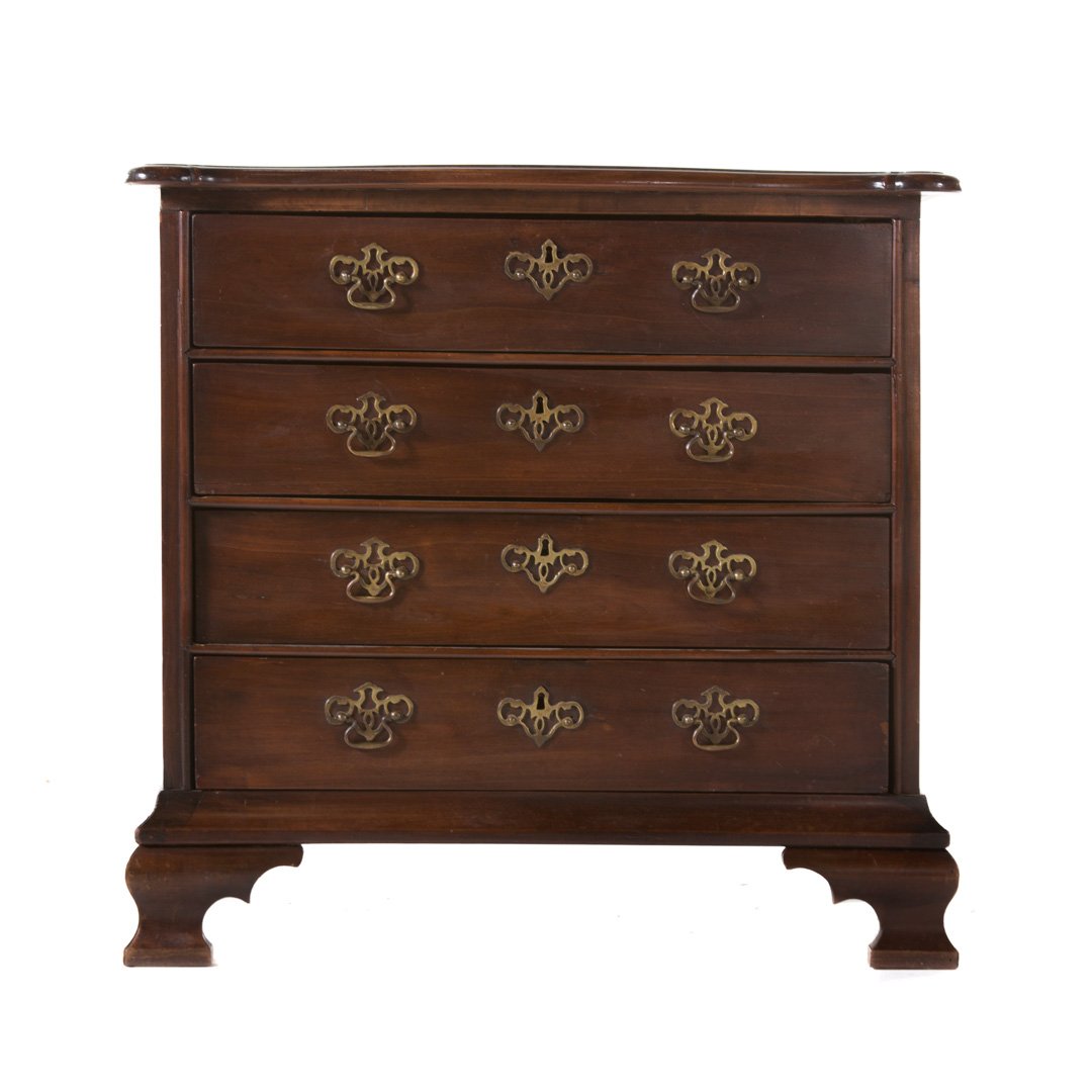 Chippendale style mahogany chest of drawers: 19th century; flat top with ovolo corners and molded edge, four long drawers, ogee bracket feet, 32 in. H., 33 in. W., 20 1/2 in. D.