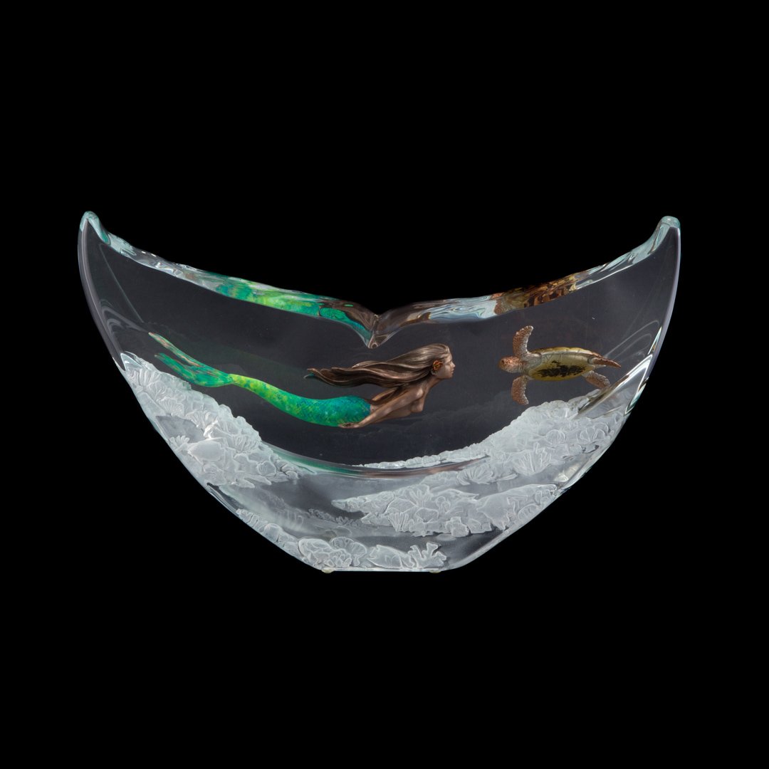 Robert Wyland. Turtle Dance, acrylic sculpture: (American, b.1956). mermaid and sea turtle among reef, whale tale shaped sculpture, signed \"Wyland,\" 9 in. H., 15 in. W.