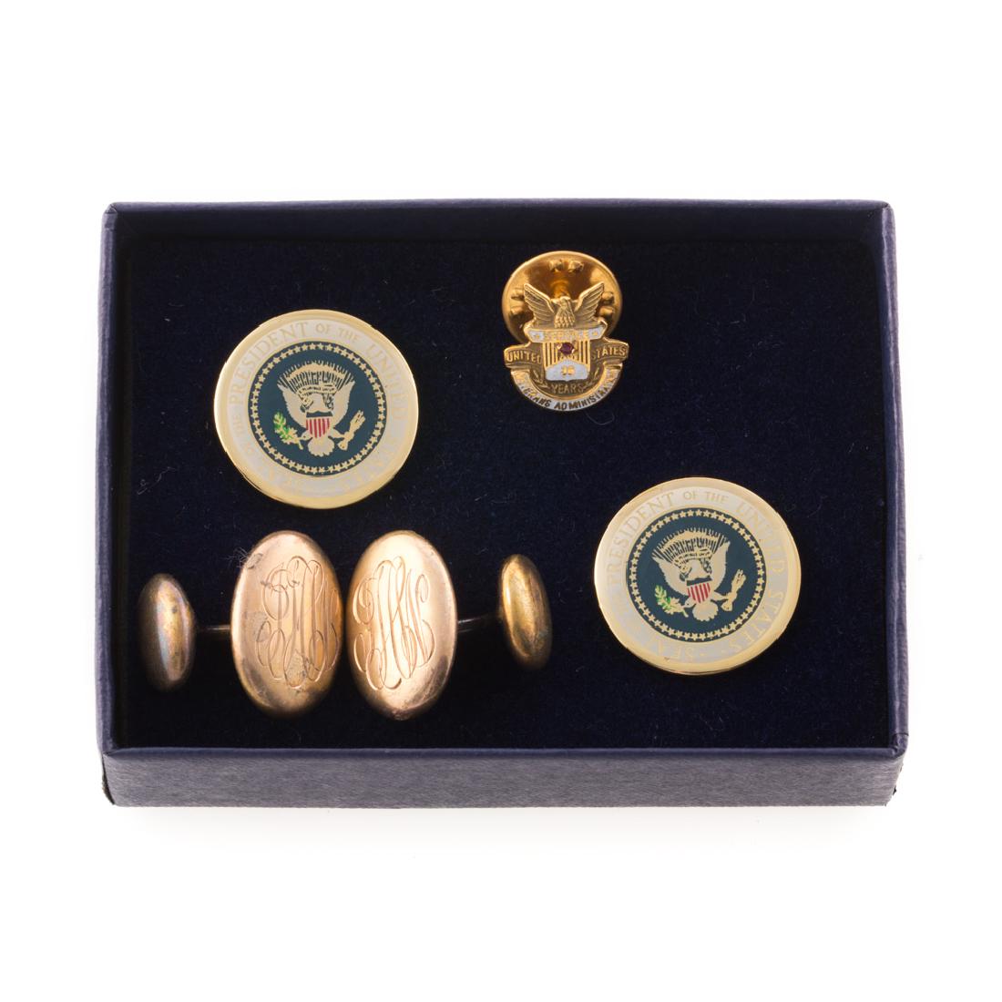 A Collection of Jewelry from Helen Bentley: 1) 14K yellow gold lapel pin "United Stated Veterans Administration 30 Year Service", 2) Gilt monogrammed cufflink, and 3) George Bush President of the United States Cufflinks