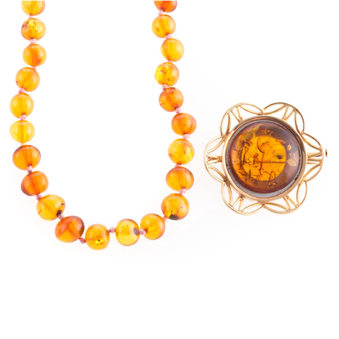 A Strand of Amber Beads and Amber Brooch (1 of 4)