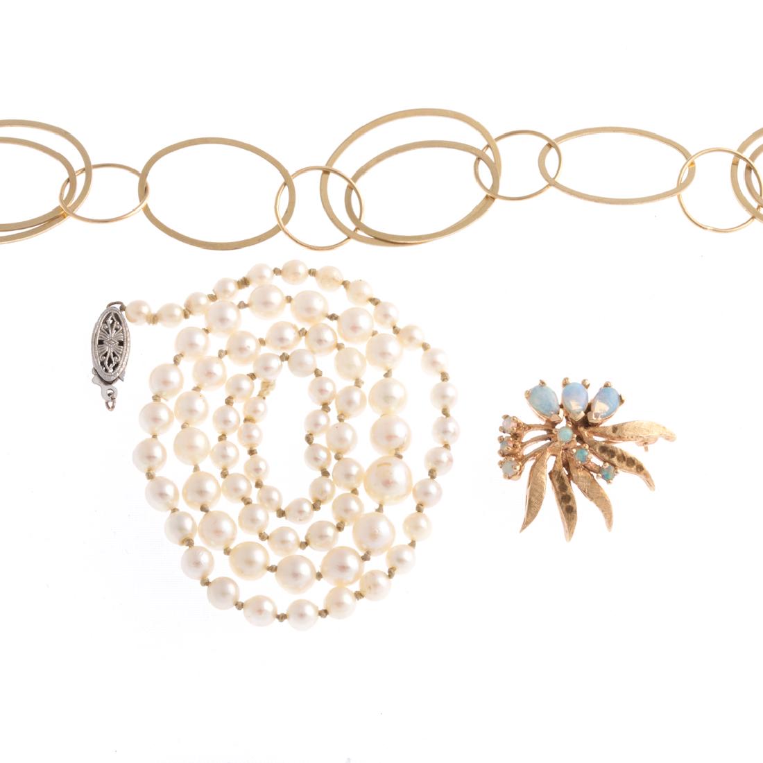 A Gold Bracelet, Strand of Pearls & Opal Pin (1 of 4)