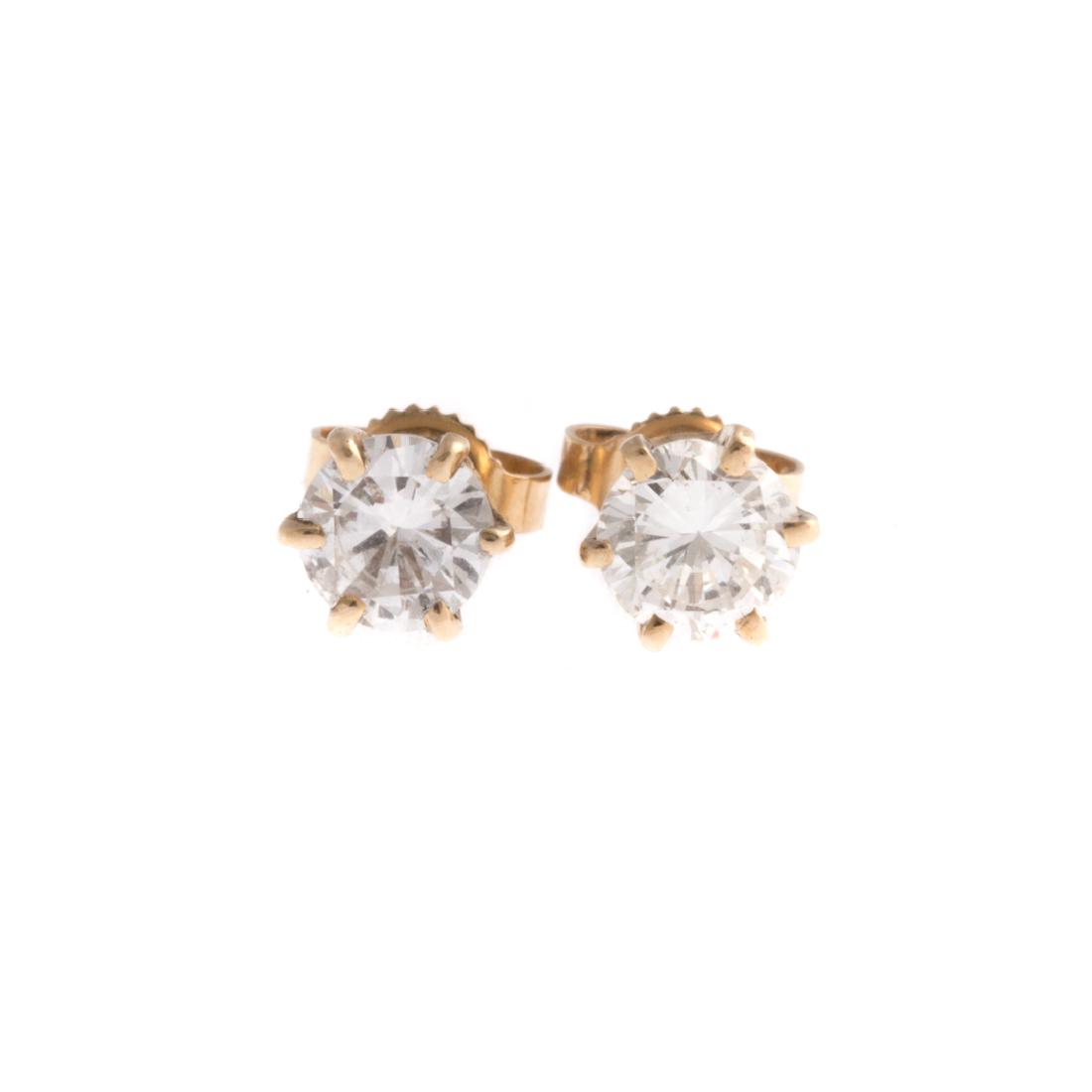 A Pair of Lady's Diamond Solitaire Earrings (1 of 2)