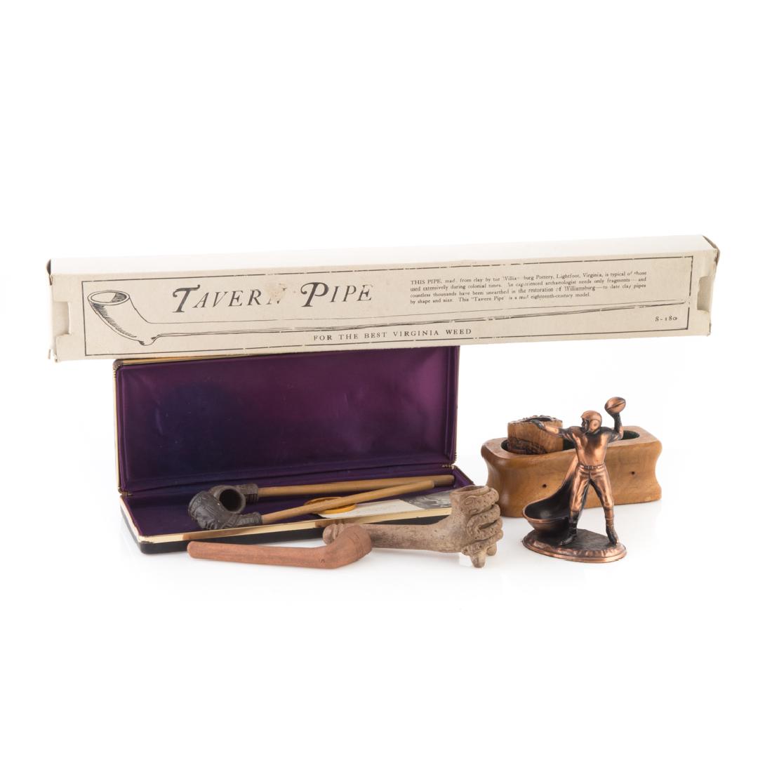 Seven assorted pipes and accessories: including; reproduction "Tavern Pipe" in box, with inscription to Gov. Mandel, dated 1976, two Indian style clay pipes, two pipes from mayor of Puerto Rico, carved wood pipe bowl with holder and a cop